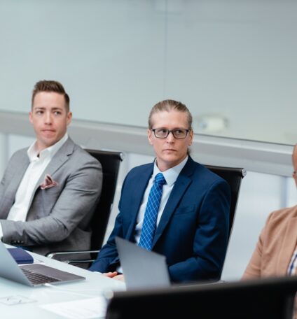 Consultants working at conference room table