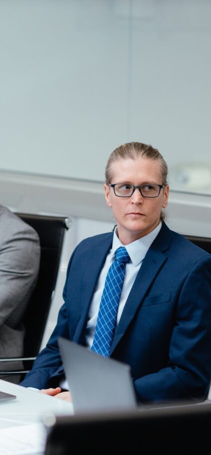 Consultants working at conference room table